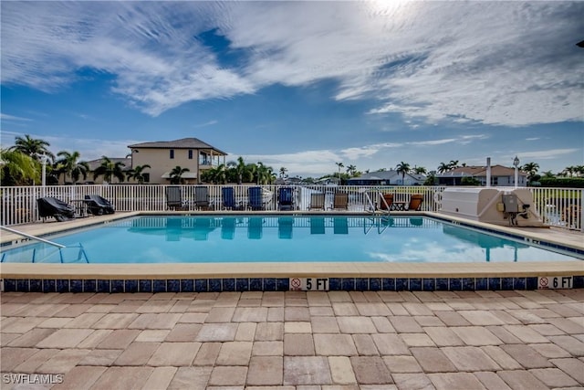 view of swimming pool featuring a patio area