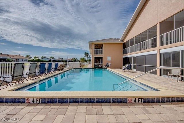 view of pool featuring a patio