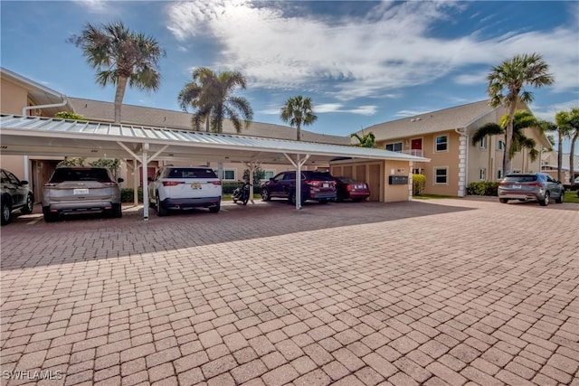 view of vehicle parking with a carport