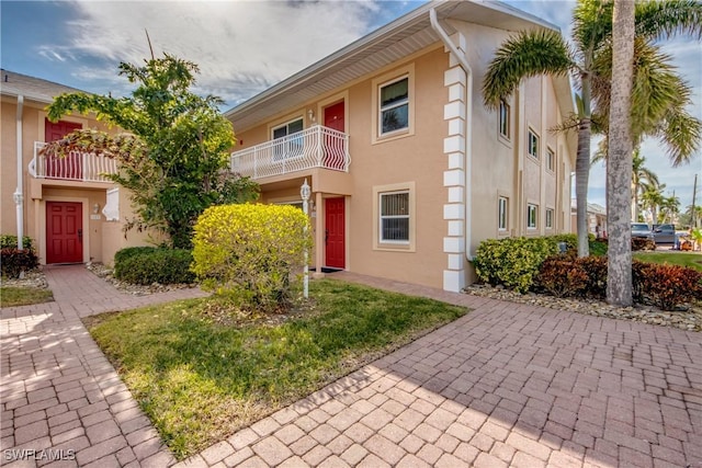 1118 SW 48th Ter Unit 104, Cape Coral, FL 33914 - view of front of property featuring stucco siding and a balcony