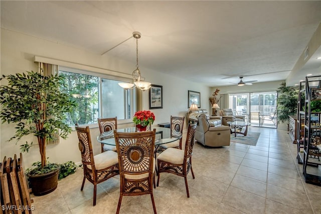 1118 SW 48th Ter Unit 104, Cape Coral, FL 33914 - dining space featuring a ceiling fan and light tile patterned floors