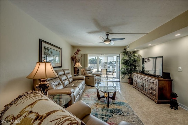 living room with ceiling fan and light tile patterned floors