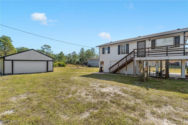 view of yard featuring a garage, an outdoor structure, and a deck