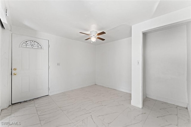 entrance foyer with ceiling fan