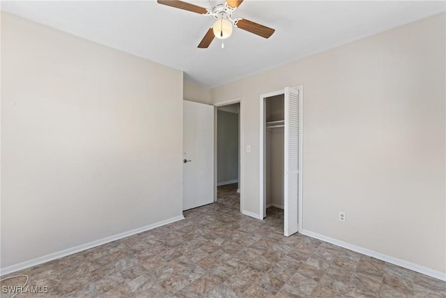 unfurnished bedroom with ceiling fan and a closet