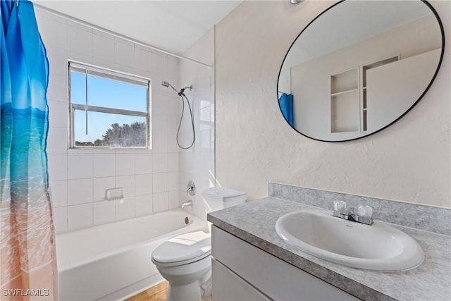 full bathroom featuring shower / bath combo, toilet, and vanity