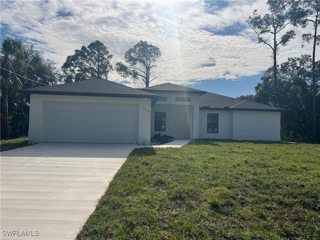 single story home with a front lawn and a garage