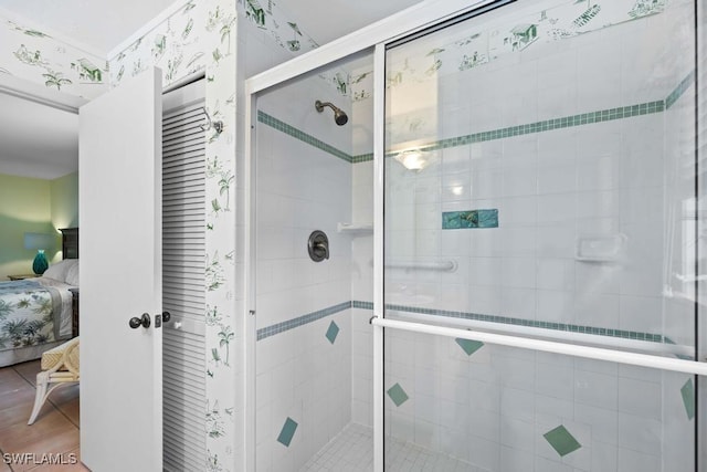 bathroom featuring tile patterned floors and an enclosed shower