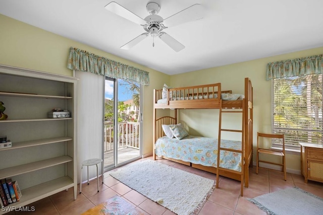 bedroom with light tile patterned flooring, access to exterior, and ceiling fan