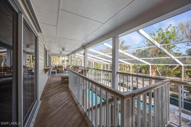 wooden deck featuring a lanai