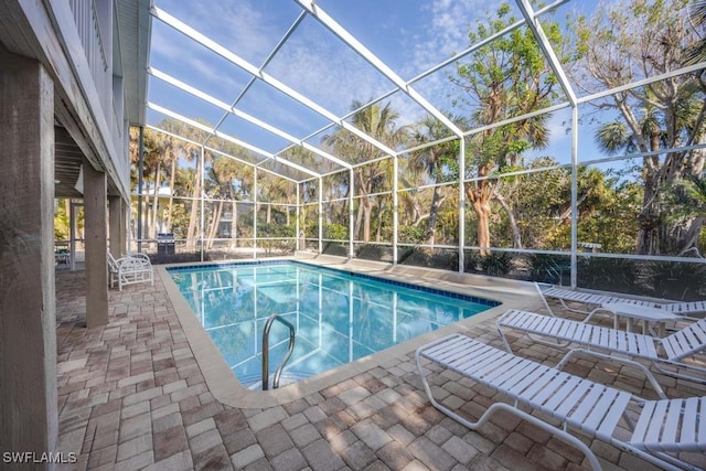 view of pool featuring a lanai and a patio