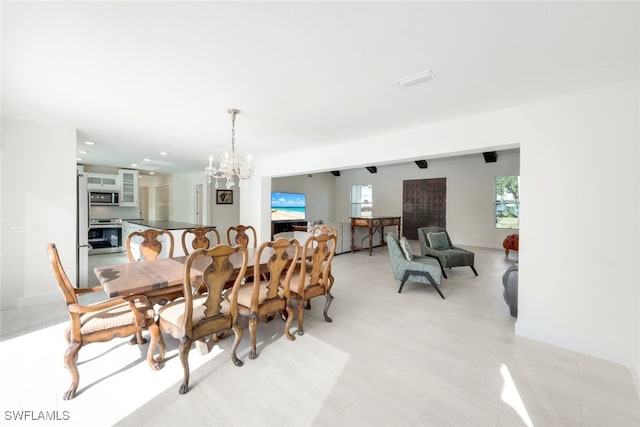 dining space with a notable chandelier