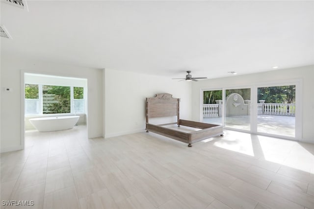 unfurnished room featuring plenty of natural light and ceiling fan