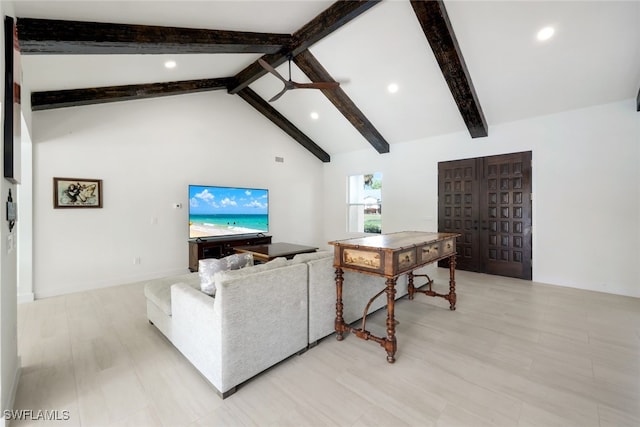 living room featuring beam ceiling and high vaulted ceiling