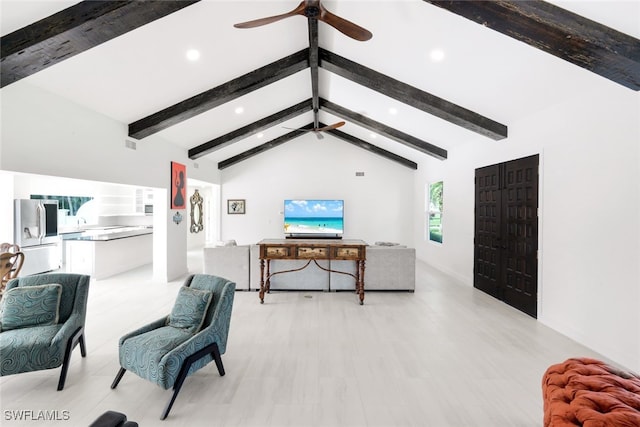 living room with ceiling fan and lofted ceiling with beams