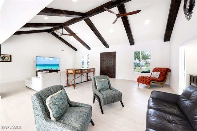 living room with ceiling fan, beamed ceiling, and high vaulted ceiling