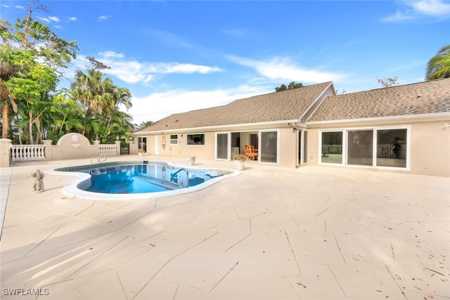 view of swimming pool with a patio area