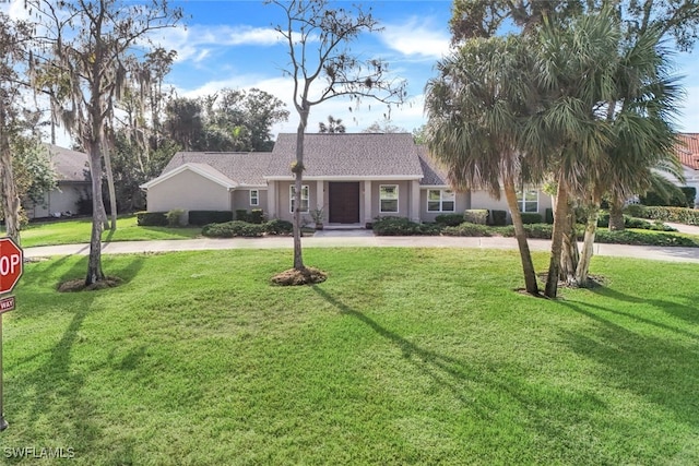 ranch-style home featuring a front lawn