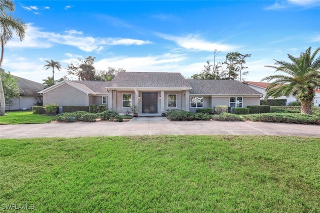 ranch-style house with a front lawn