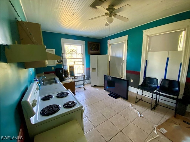 kitchen with ceiling fan, sink, light tile patterned floors, and white appliances