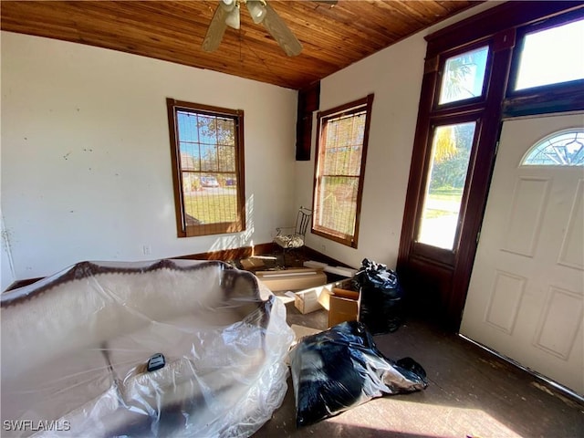 entryway featuring ceiling fan and wooden ceiling