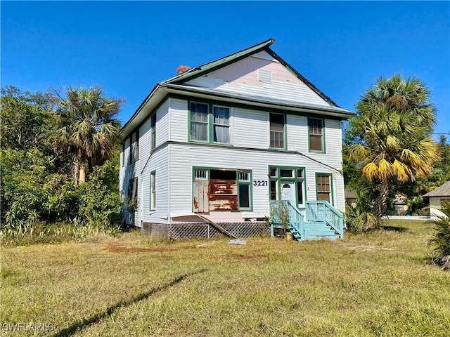 view of front of home with a front yard