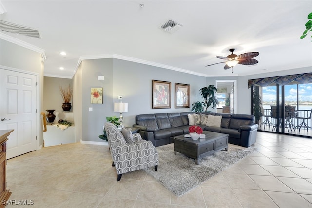 living room featuring ceiling fan, light tile patterned floors, and crown molding