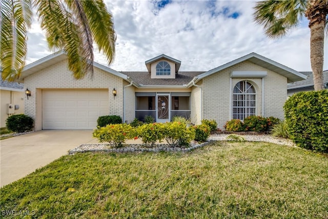 view of front of property with a front yard and a garage