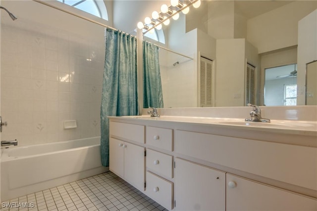 bathroom featuring ceiling fan, tile patterned flooring, vanity, and shower / bath combo