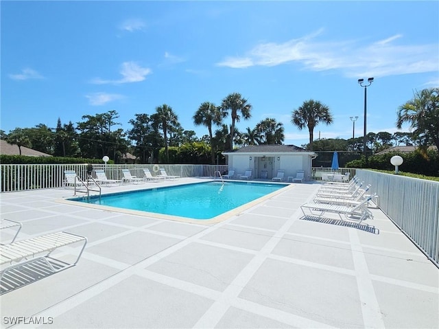 view of swimming pool with a patio