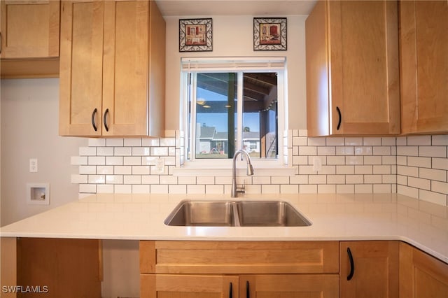 kitchen featuring sink and backsplash