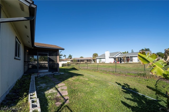 view of yard featuring a sunroom