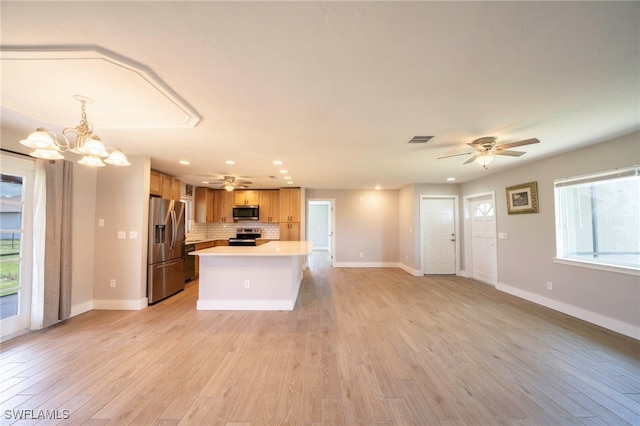 6080 Park Rd, Fort Myers, FL 33908 - kitchen with appliances with stainless steel finishes, a ceiling fan, light countertops, open floor plan, and recessed lighting