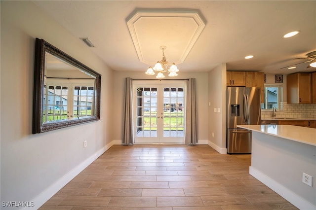 6080 Park Rd, Fort Myers, FL 33908 - unfurnished dining area with a chandelier, light wood-type flooring, baseboards, recessed lighting, and french doors