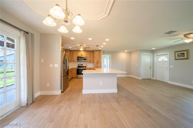 6080 Park Rd, Fort Myers, FL 33908 - kitchen featuring stainless steel appliances, ceiling fan, light countertops, light wood finished floors, and a chandelier