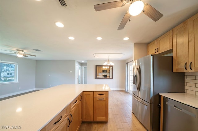 6080 Park Rd, Fort Myers, FL 33908 - kitchen featuring stainless steel appliances, ceiling fan, light wood-style flooring, light countertops, and baseboards