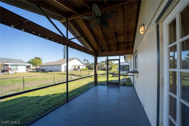 6080 Park Rd, Fort Myers, FL 33908 - unfurnished sunroom featuring ceiling fan and a residential view