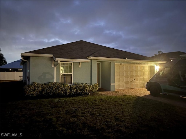 back of property with a garage