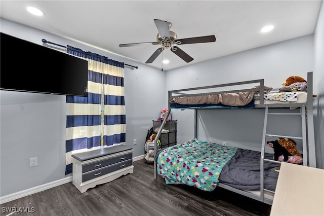 bedroom with ceiling fan and dark hardwood / wood-style floors