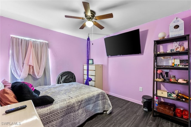 bedroom featuring ceiling fan and dark hardwood / wood-style floors