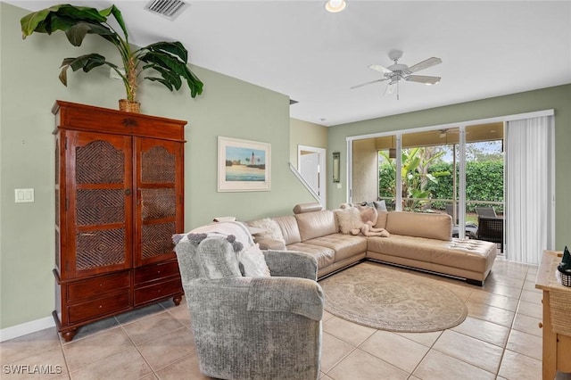 living room with ceiling fan and light tile patterned floors