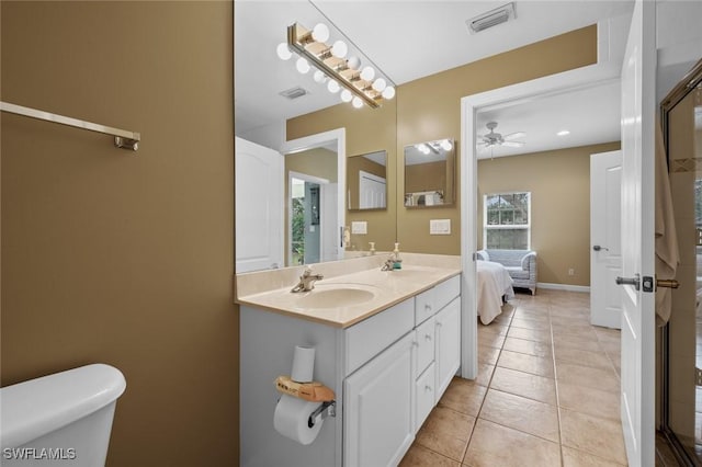 bathroom featuring tile patterned floors, ceiling fan, toilet, and vanity