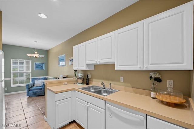 kitchen featuring pendant lighting, dishwasher, an inviting chandelier, white cabinets, and sink