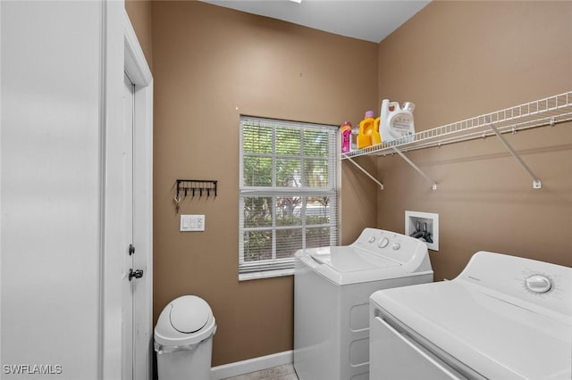 washroom featuring independent washer and dryer and light tile patterned floors