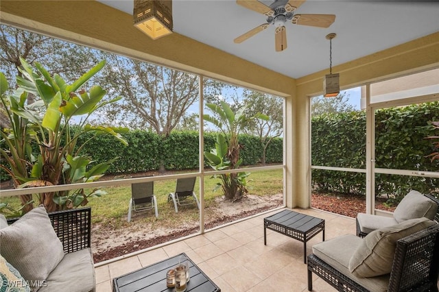 sunroom with ceiling fan