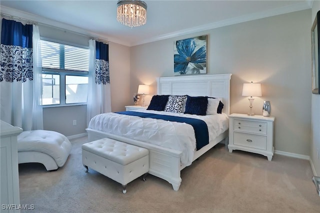 carpeted bedroom featuring crown molding and an inviting chandelier