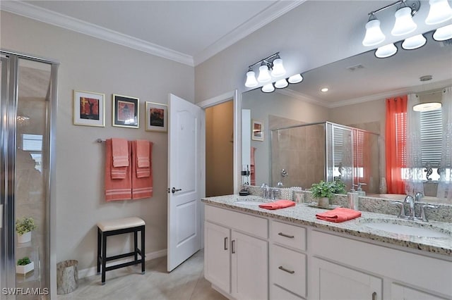 bathroom with vanity, tile patterned floors, a shower with door, and ornamental molding