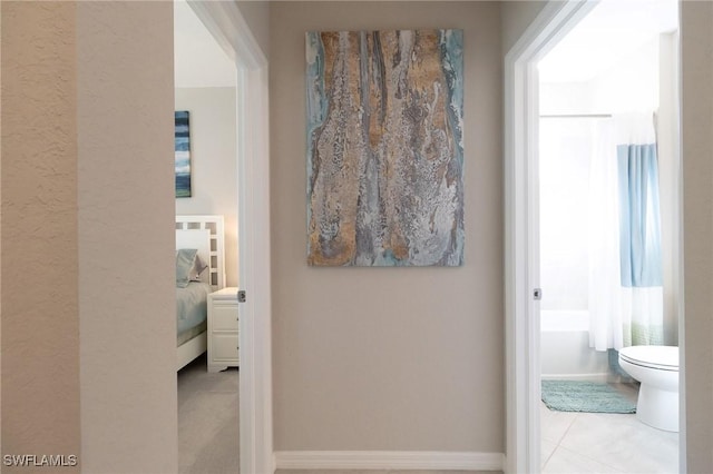 hallway with light tile patterned flooring