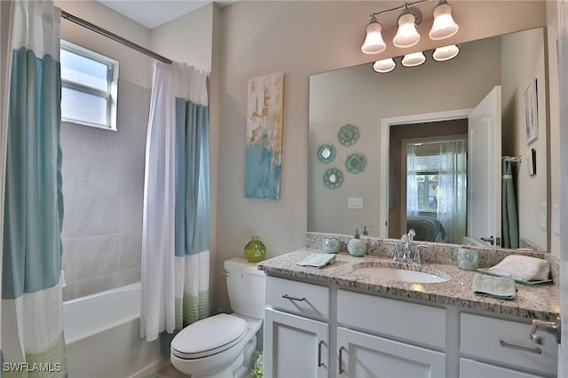 full bathroom featuring toilet, vanity, and shower / bath combo with shower curtain