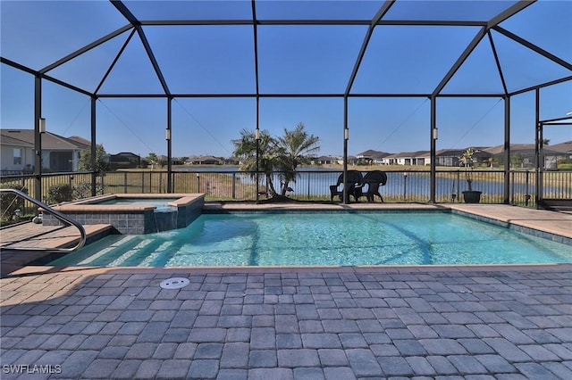 view of swimming pool featuring an in ground hot tub, a lanai, a water view, and a patio area